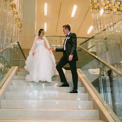 Bride And Groom Walking Down Grand Hyatt Melbourne's Staircase